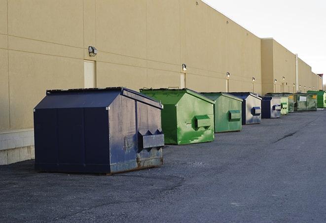 a stack of yellow construction dumpsters on a job site in Garfield Heights